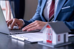 Businessman printing contract documents for purchase and home insurance home insurance concept, home