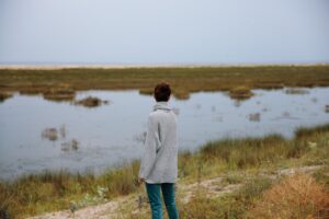 woman admire nature walk behind