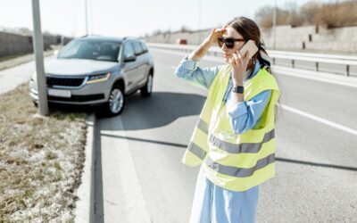 Woman calling during the road accident on the highway